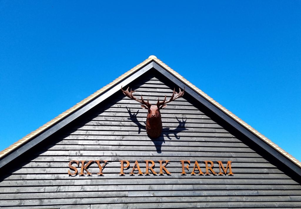 Sky Park Farm Sign. With Stag sculpture