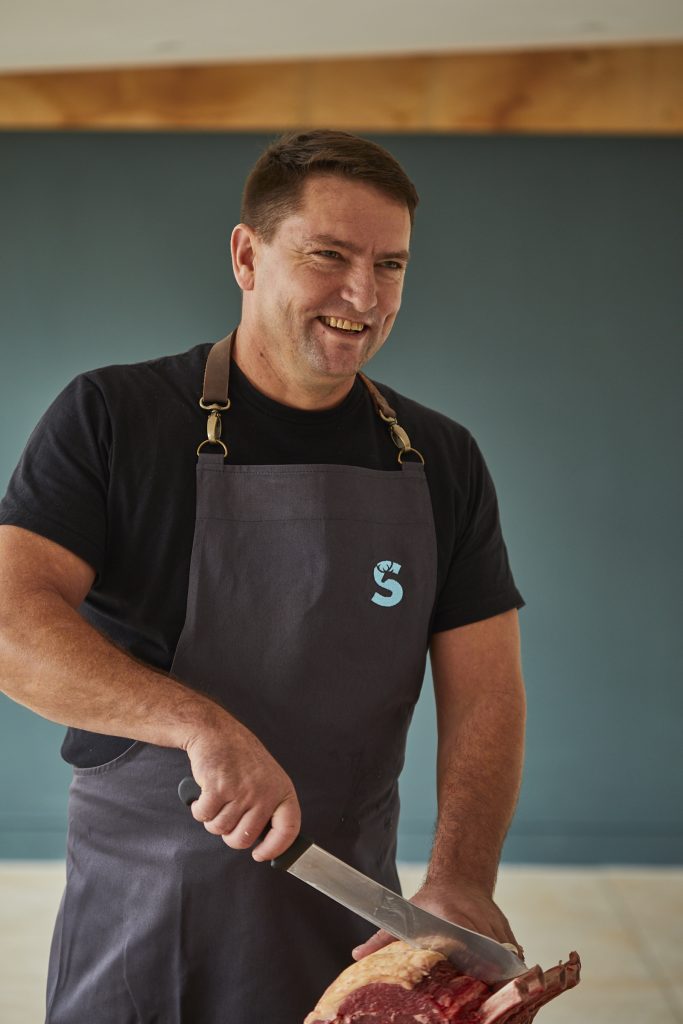 Hawie, Sky Park Farms butcher in an apron