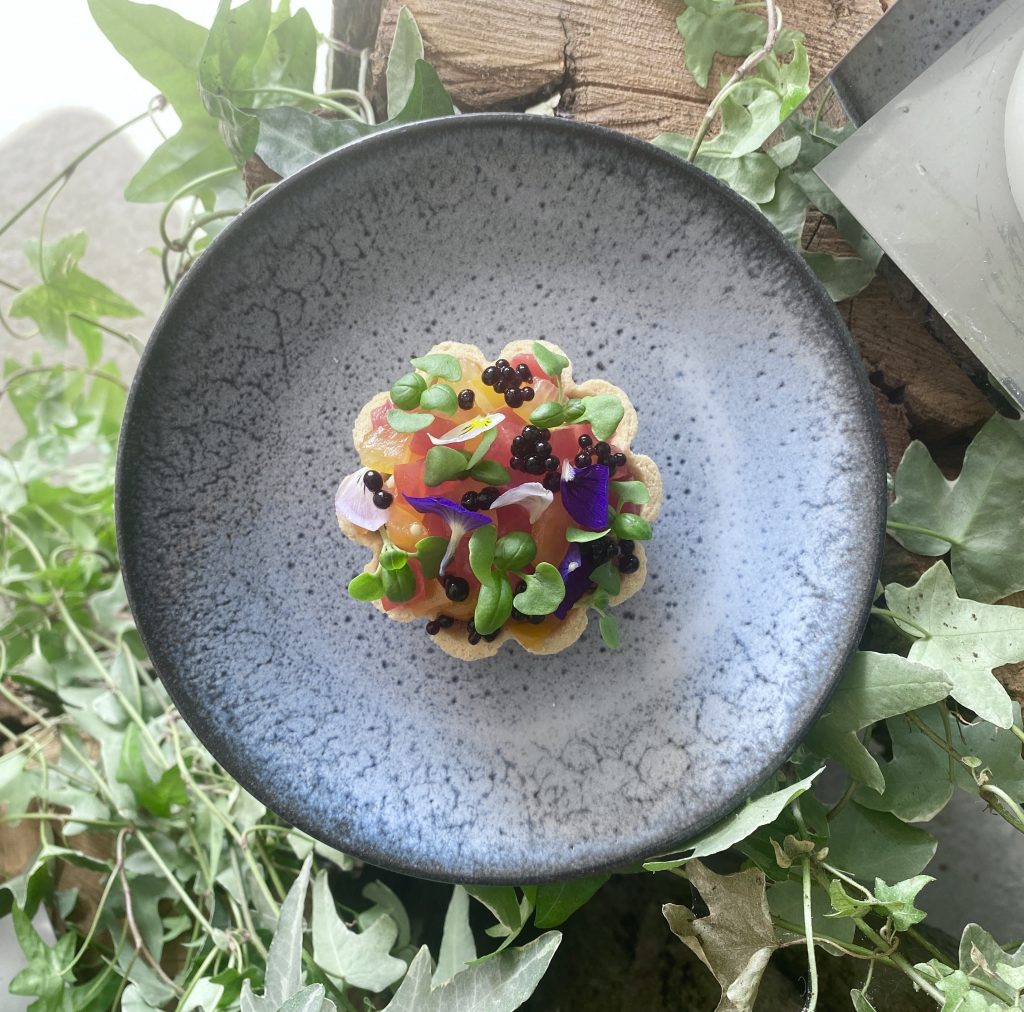 seasonal tomatoes in pastry case on a plate